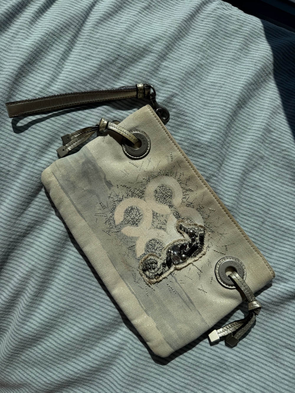 RARECoach Ivory Canvas Wristlet with Metallic Embellishment Seahorse collection